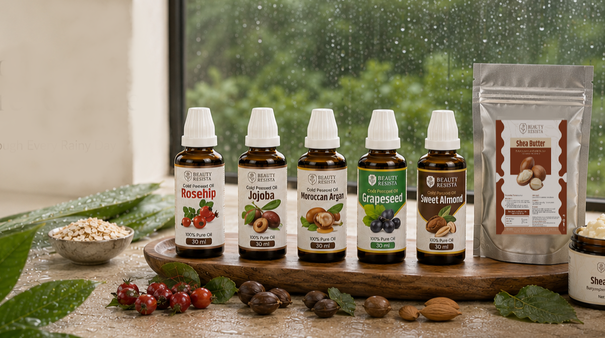 Beauty Resista monsoon skincare routine featuring Rosehip Oil, Jojoba Oil, Moroccan Argan Oil, Grapeseed Oil, Sweet Almond Oil, and Shea Butter in a premium botanical setting beside a rain-covered window.